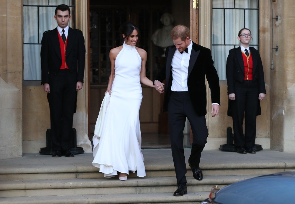 Prince Harry escorts his new bride as they made their way to Frogmore House