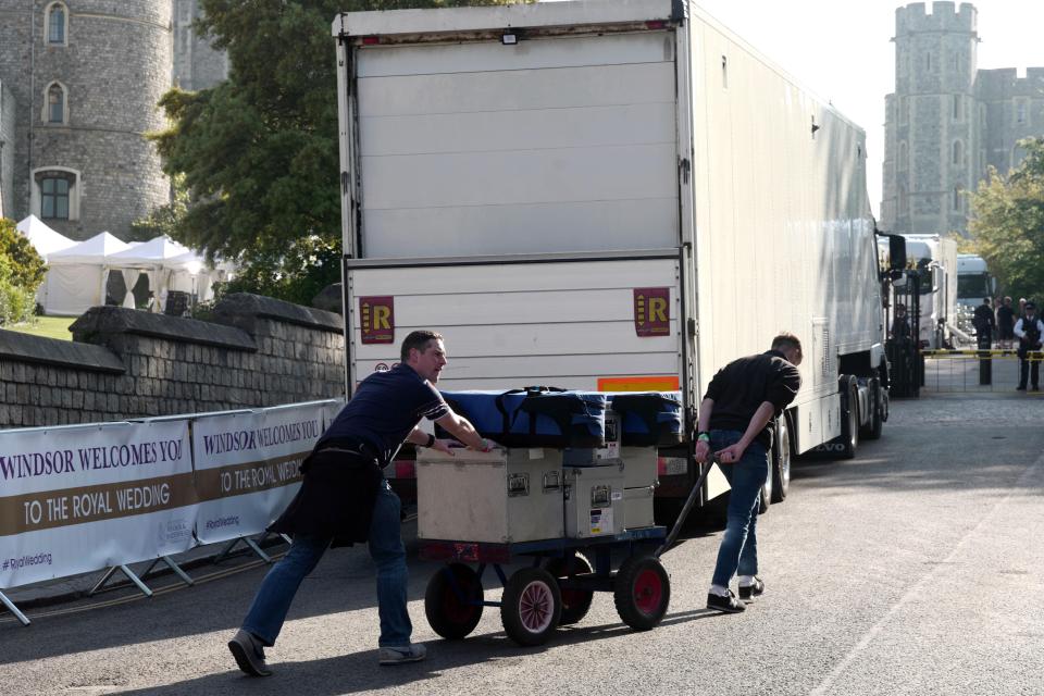  A Windsor Castle turret looms in the background as clean up staff haul equipment