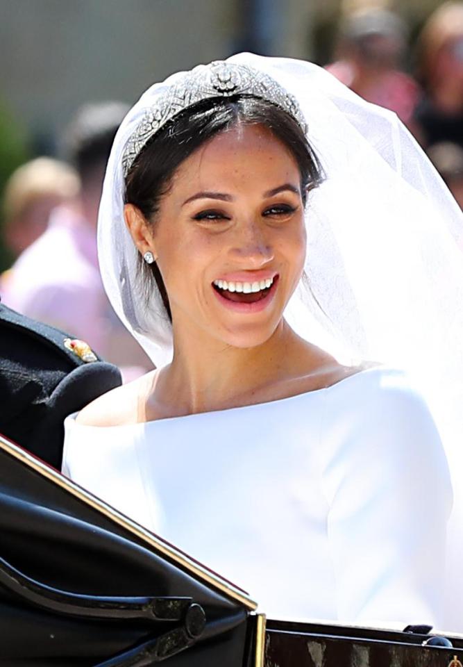  Meghan, the Duchess of Sussex, pictured above on her wedding day to Prince Harry