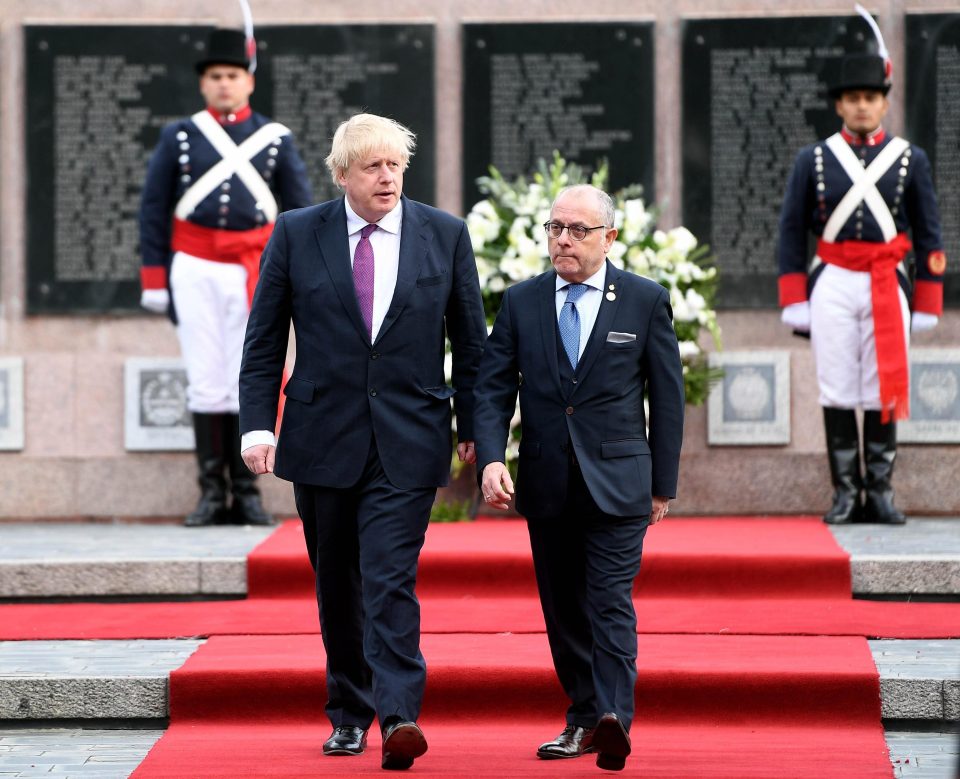  Boris Johnson lays a wreath at a Falklands War memorial in solemn ceremony with Foreign Minister Jorge Faurie