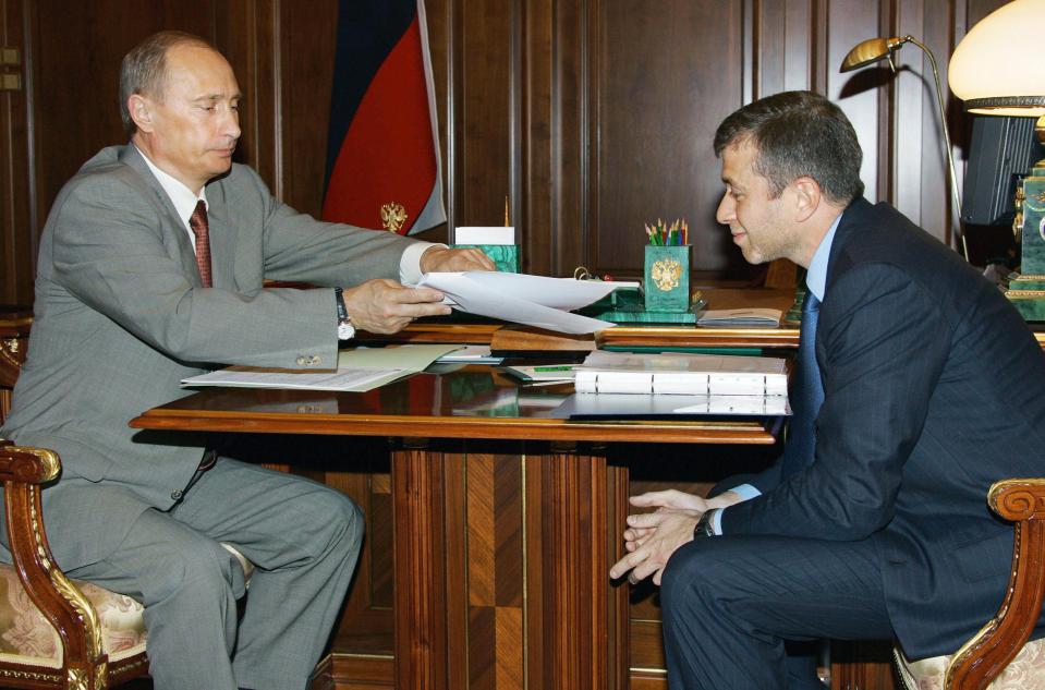  Roman Abramovich's close relations with Vladimir Putin has helped him become a billionaire. File picture showing the allies in 2005