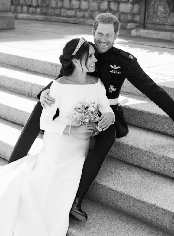  The happy couple posing after they exchanged vows on Saturday