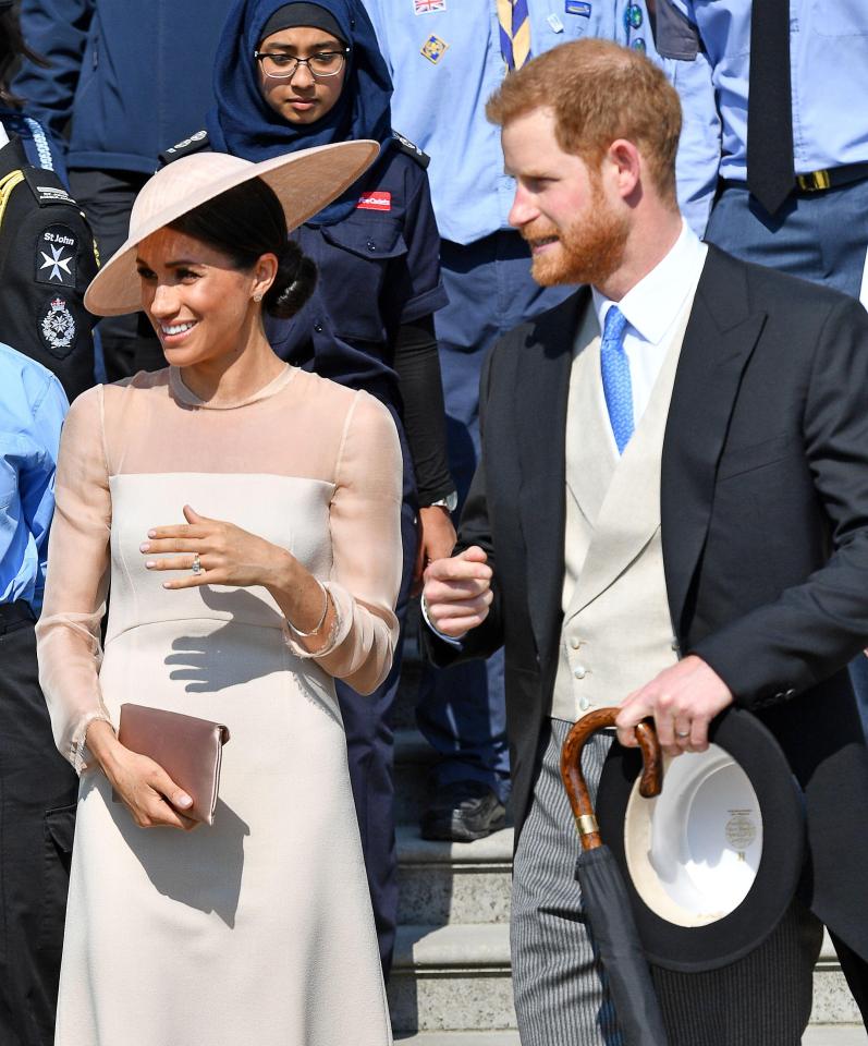  Meghan attended the event with husband Harry who dressed to impress in a morning suit and blue tie