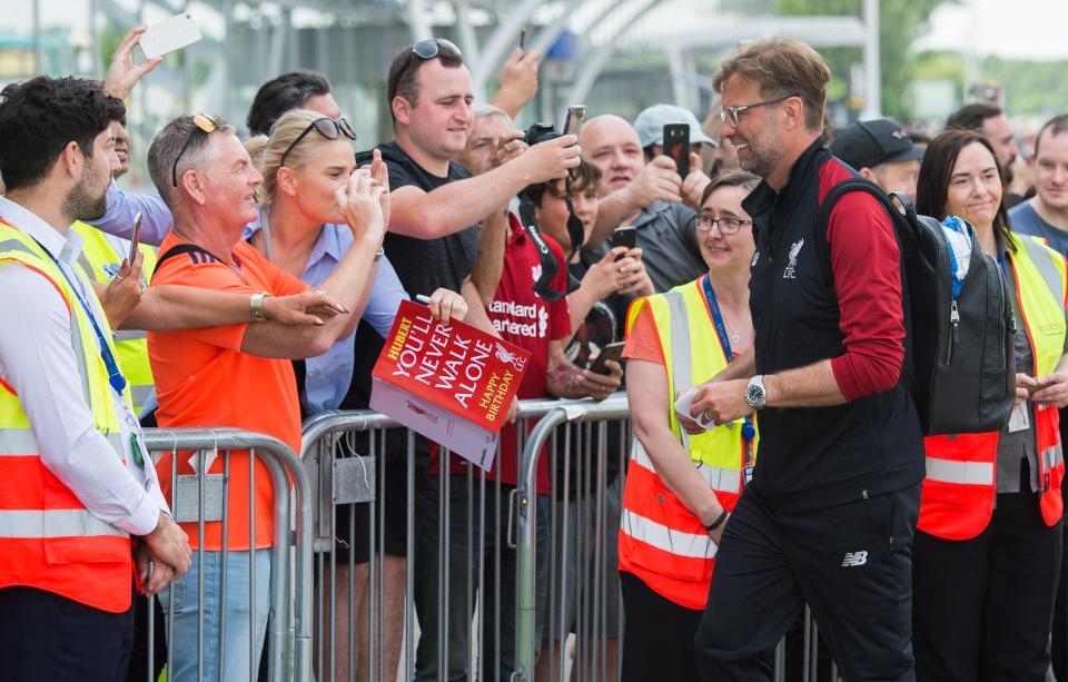  Fans waited outside John Lennon airport as Liverpool headed for the plane