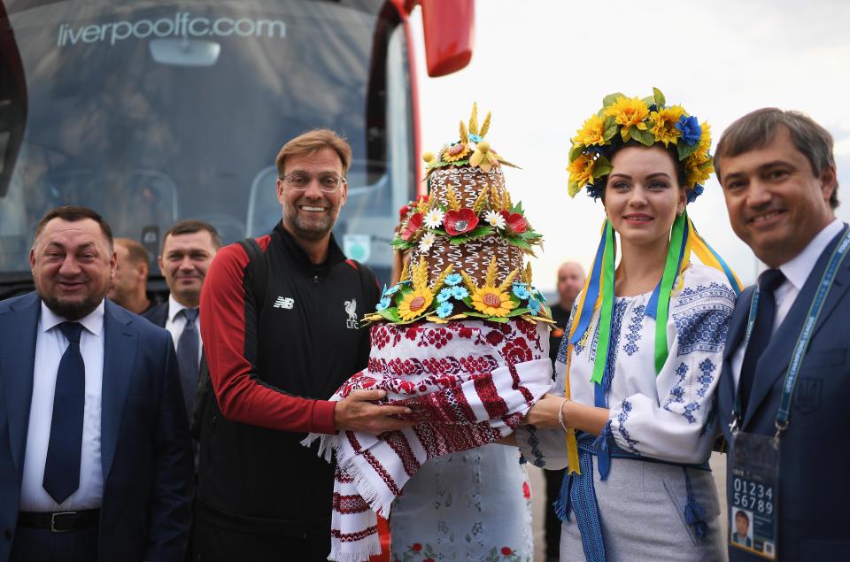  Women in traditional dress were at the airport to greet the Liverpool stars