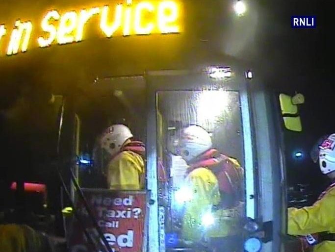  Rescuers enter the bus, which still has its 'not in service' sign illuminated