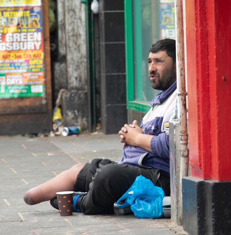  Burnt Oak High Street is run down with many shops boarded up and beggars on the streets