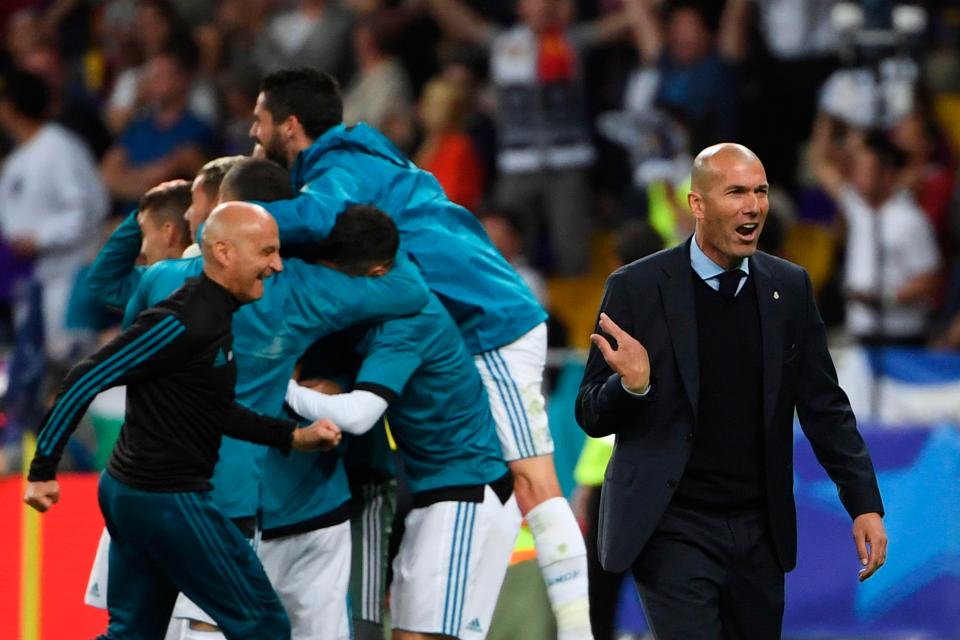  Zidane reacts from the sidelines after watching Bale restore his side's lead