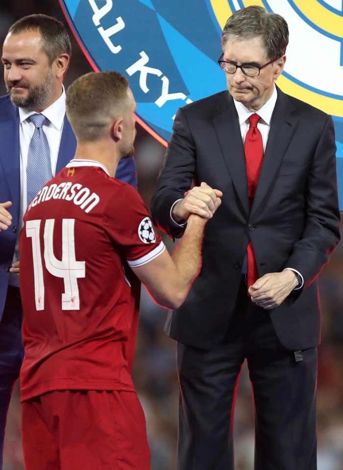  Liverpool owner John W Henry commiserates with captain Jordan Henderson