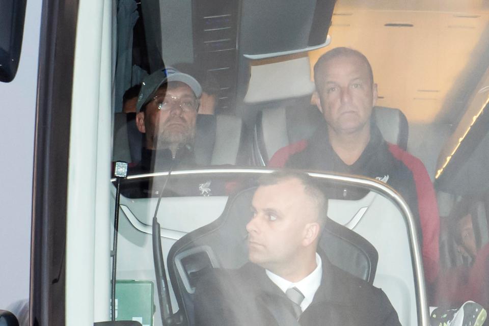 Jurgen Klopp was sat next to kit management co-ordinator Lee Radcliffe as he looked from the front of the bus