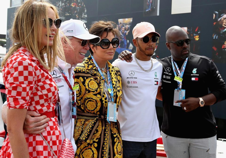  Lewis Hamilton poses for a photo with Dee Hilfiger, Tommy Hilfiger, Kris Jenner and Corey Gamble