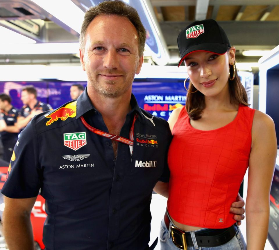  Bella faces the camera with Red Bull principal Christian Horner