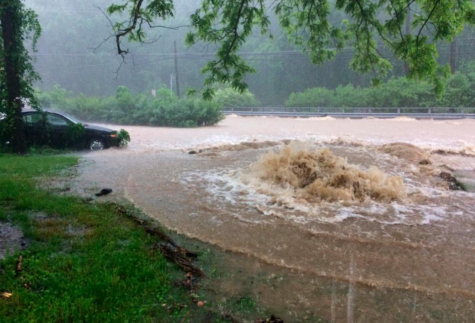  Flood water gushes, leaving cars stranded in Maryland