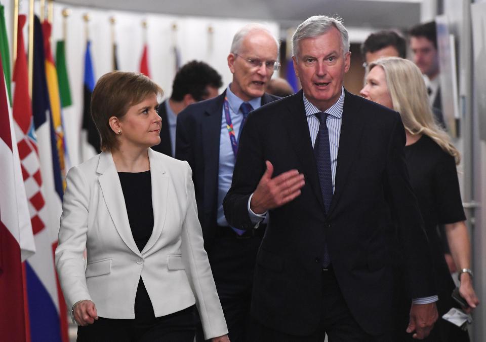  Nicola Sturgeon, pictured in Brussels with EU envoy Michel Barnier today, criticised the Government