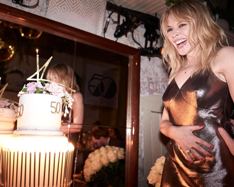  The 50-year-old looked happier than ever as she prepared to blow out the candle on her cake