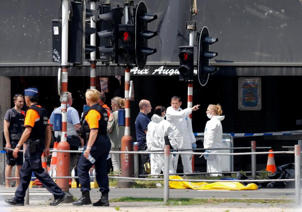  Forensics experts also attend the scene of the shooting in Liege