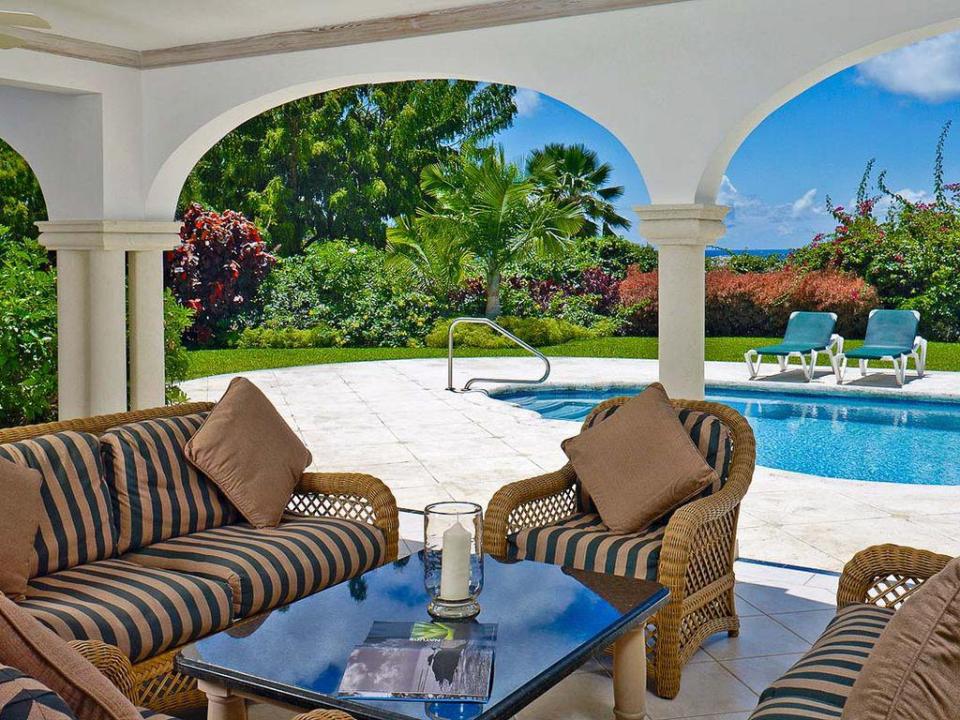 Outdoors, guests can relax in the shade of the covered terrace with views of the ocean