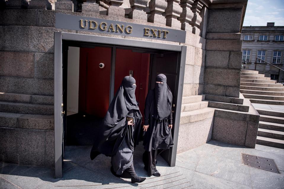  Women wearing niqabs walk out of the Danish parliament in Copenhagen