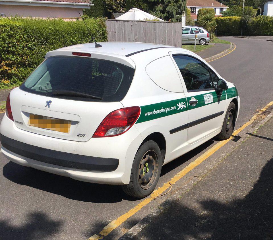  A council car was caught parking on a solid yellow line