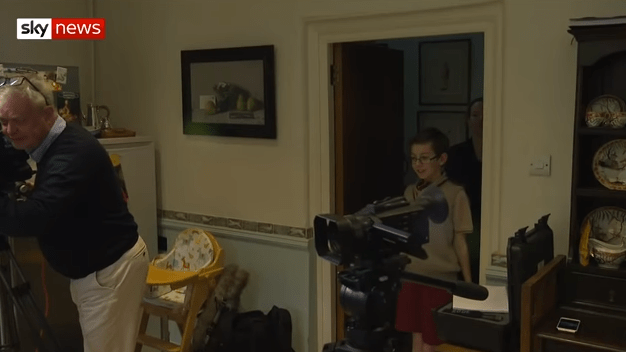  Peter was peeking into the kitchen to see what his Dad was up to, surrounded by cameras