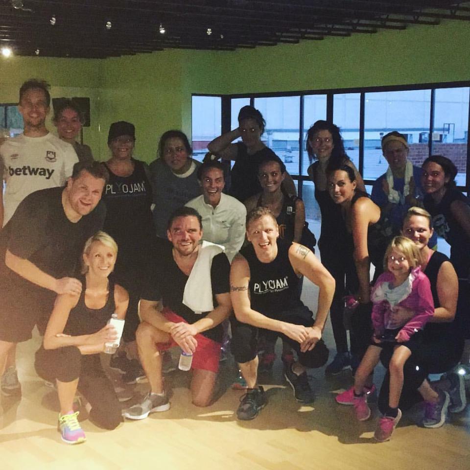  James, pictured here with trainer Jason and wife Julia, has dropped five stone since moving to LA