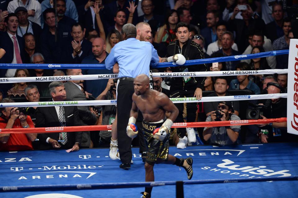  Former five-weight world champion Mayweather celebrates after extending his record to 50-0