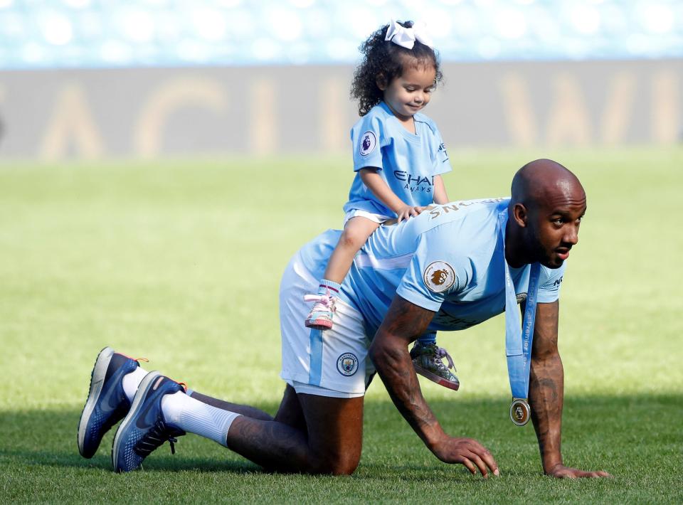  Fabian Delph celebrates winning Premier League title with daughter