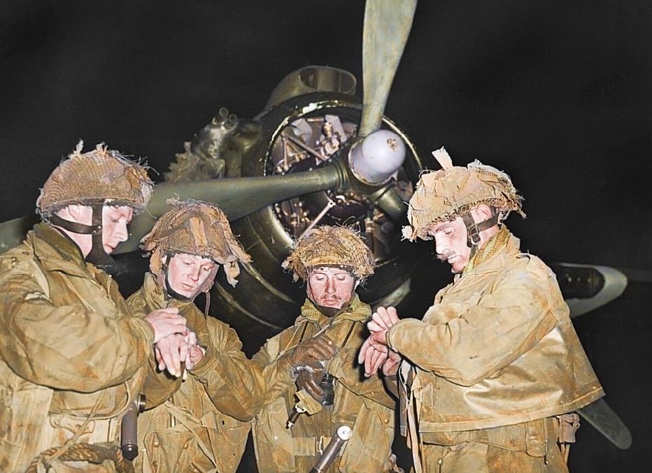  British Airborne Pathfinders check their watches on the night before the invasion