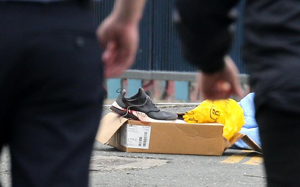  A blood-stained trainer outside the gym