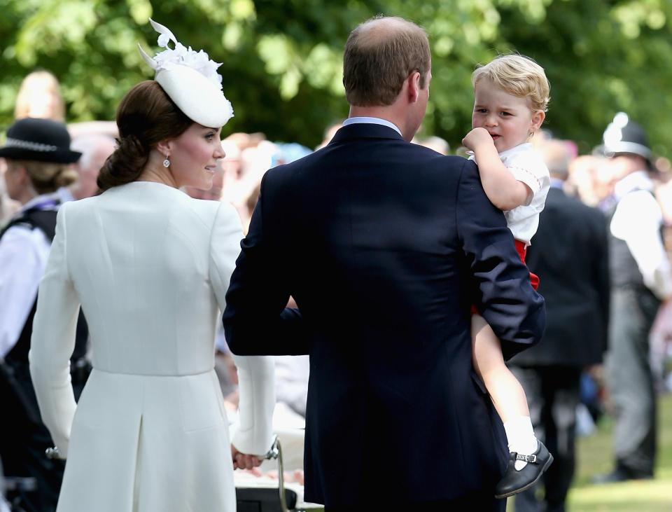 Kate, with Prince William and George, seen with no buttons on her sleeve as she leaves Charlotte's Christening in 2015