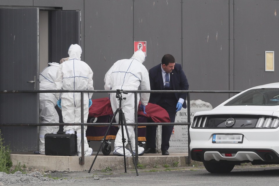 A body is removed from Bray Boxing Club, Bray, Co Wicklow, where three people were shot this morning