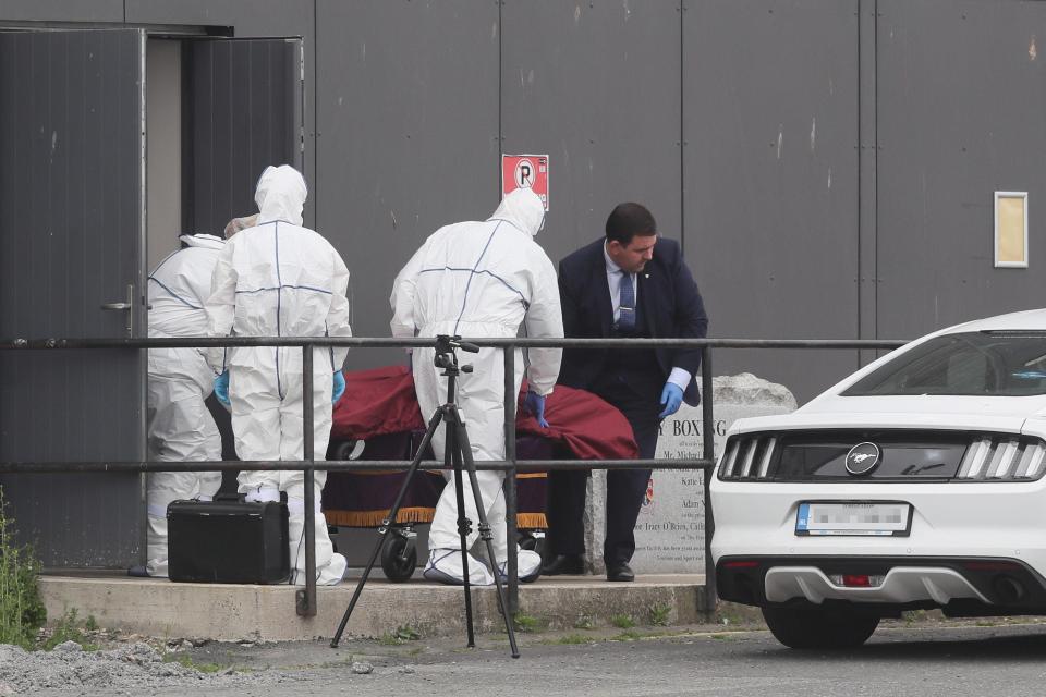  A body is removed from Bray Boxing Club, Bray, Co Wicklow, where three people were shot this morning