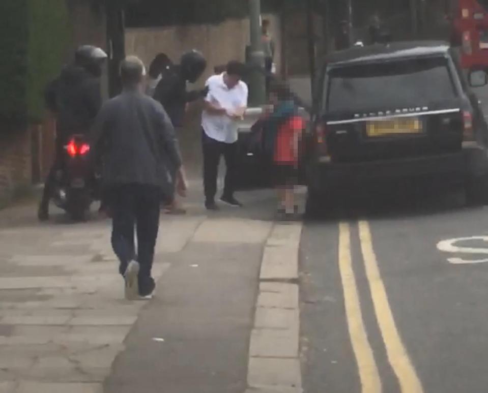  Michael McIntyre was forced to hand over his watch as his son looked on in North West London