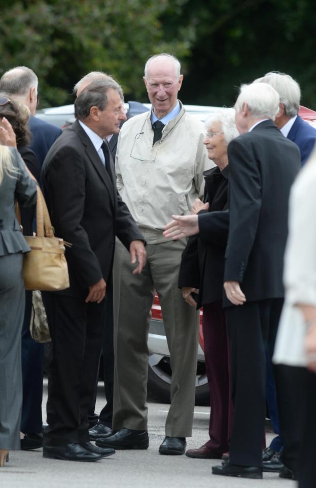  Roger Hunt joins his England team-mates in conversation before the service