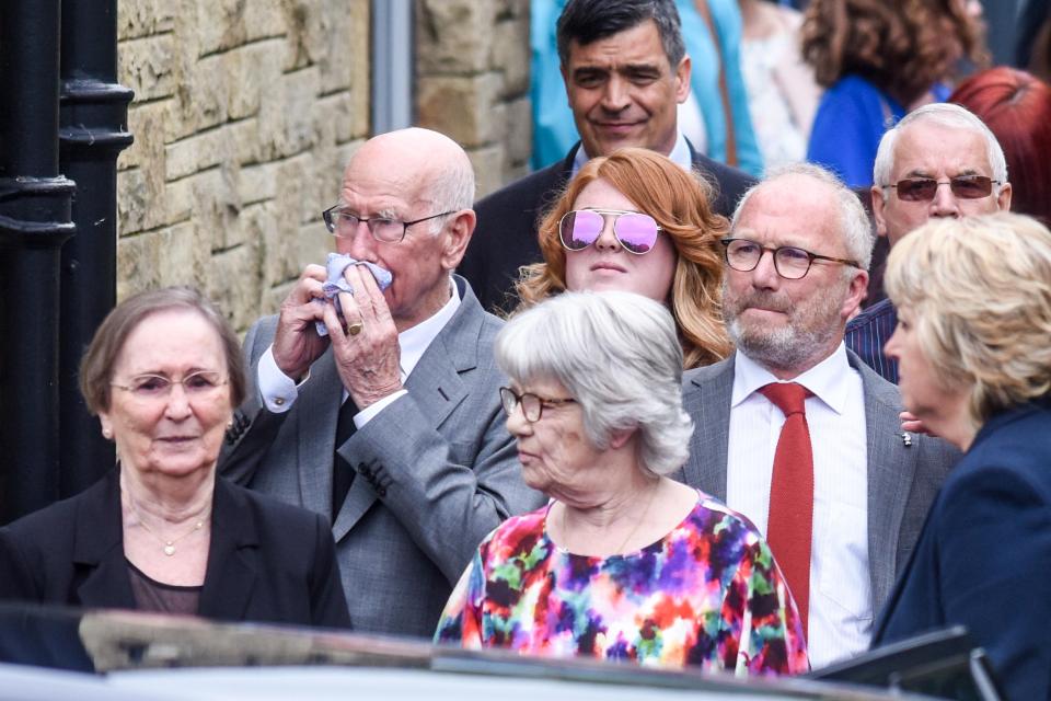  Sir Bobby Charlton leaves the service with fellow mourners