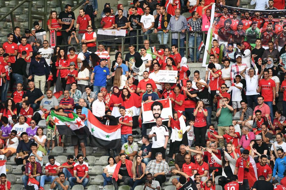  Egypt fans hold up a Mo Salah poster during their friendly against Belgium