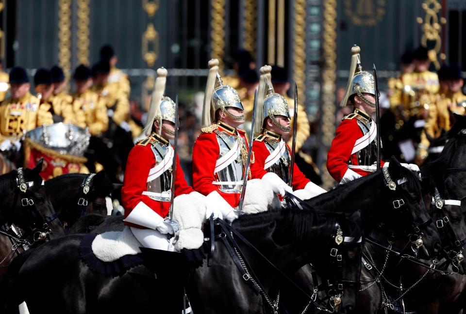  Members of The Household Cavalry ride past Buckingham Palace