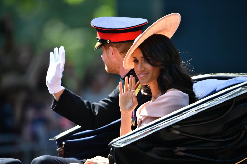  The newlyweds wave to the crowds as they attended the Trooping the Colour ceremony