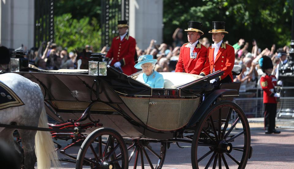  The Queen rides in a carriage to attend the Trooping the Colour ceremony today