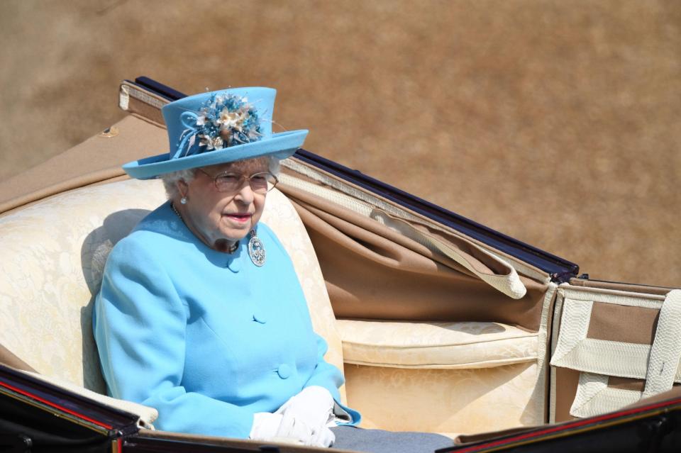  The Queen, who travelled in an Ascot Landau, is wearing a sky blue coat and dress by Stuart Parvin, and a hat by Angela Kelly