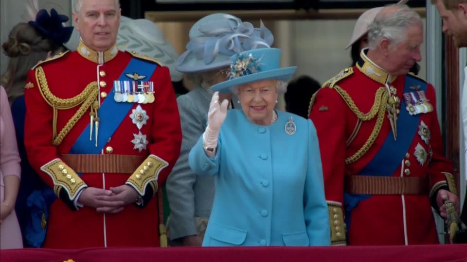  The Queen waves to the crowds during the ceremony to mark her official birthday