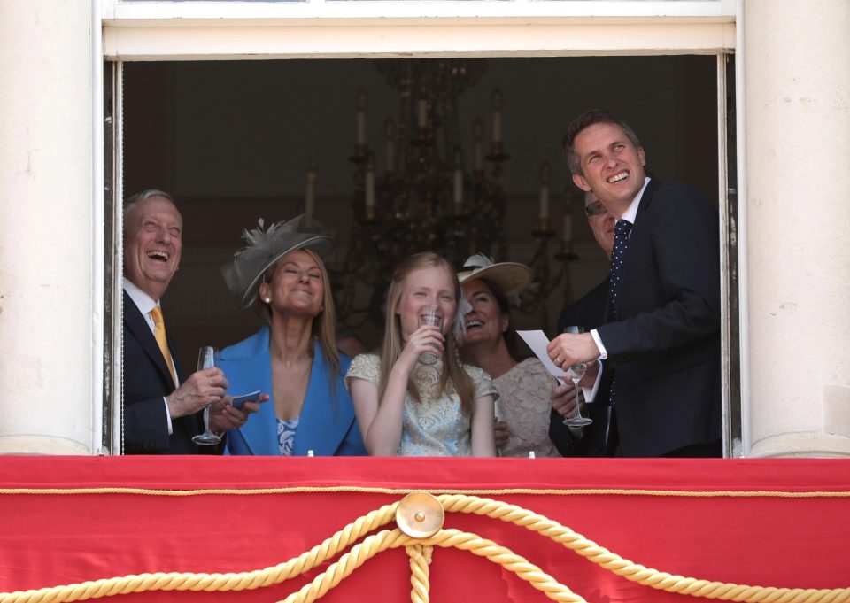  Secretary of State for Defence, Gavin Williamson watches the flypast from a window of Buckingham Palace