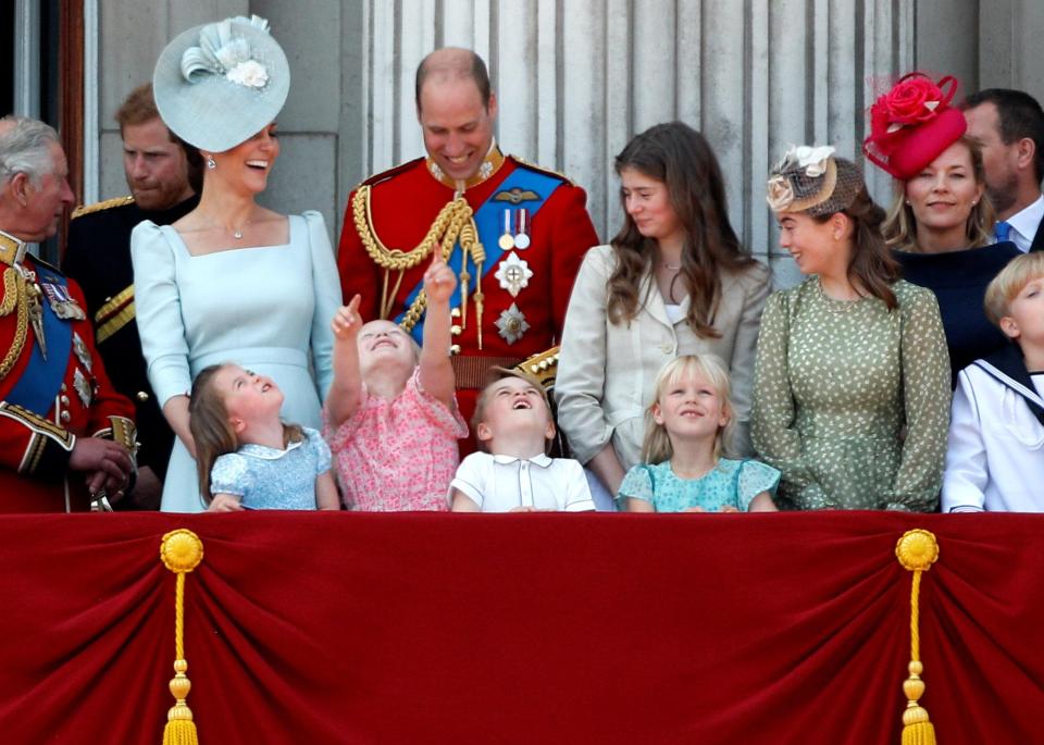  Younger members of the Royal Family, along with Kate and Wills, look up at the RAF flypast