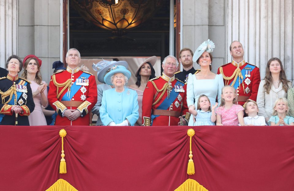  Princess Anne, Princess Royal, Princess Beatrice, Lady Louise Windsor, Prince Andrew, Duke of York, Queen Elizabeth II, Meghan, Duchess of Sussex, Prince Charles, Prince of Wales, Prince Harry, Duke of Sussex, Catherine, Duchess of Cambridge, Prince William, Duke of Cambridge, Princess Charlotte of Cambridge, Savannah Phillips, Prince George of Cambridge and Isla Phillips watch the flypast