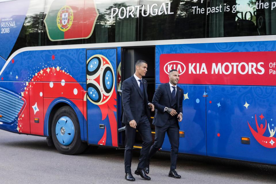  Cristiano Ronaldo walks in front of the Portugal bus and its official message