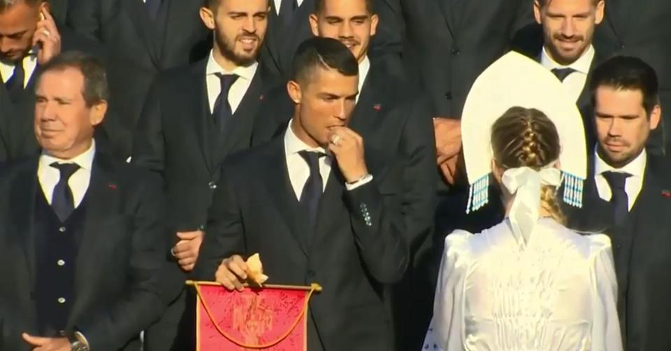  Ronaldo looked nervous as he tucked into the bread and salt, much to the amusement of his team mates