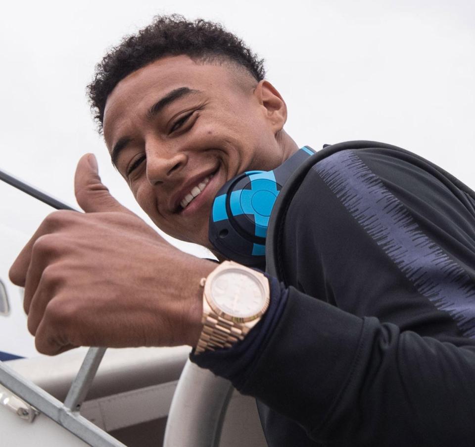  Jesse Lingard smiles for the cameras as he heads off to the World Cup