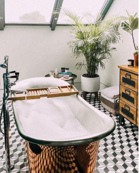  While one of her four bathrooms has this huge freestanding copper bathtub