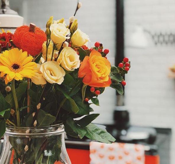  The couple's kitchen has a bright orange Aga