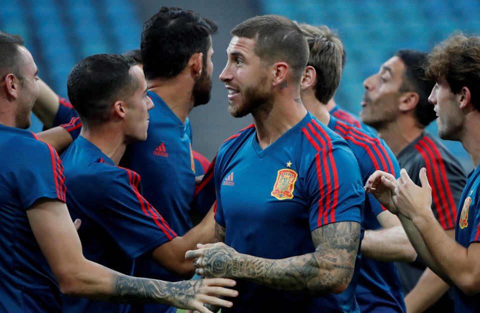  Spain skipper Sergio Ramos was all smiles at training with colleagues but was less happy when discussing his efforts in the Champions League final with Real Madrid